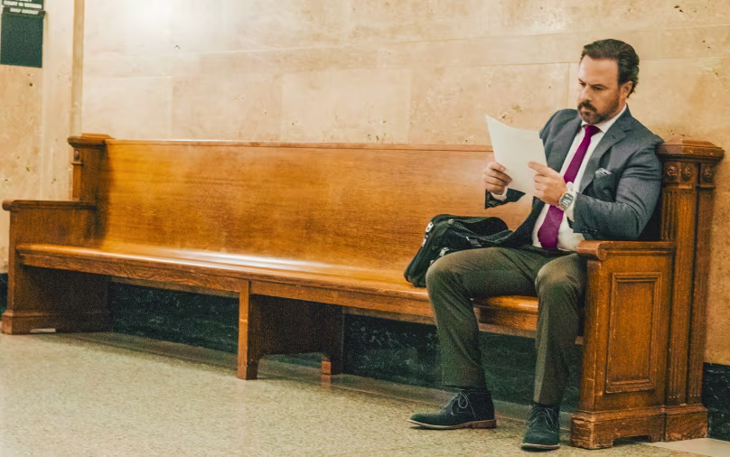 Jeremy Rosenthal Denver personal injury attorney reviewing case documents in courthouse