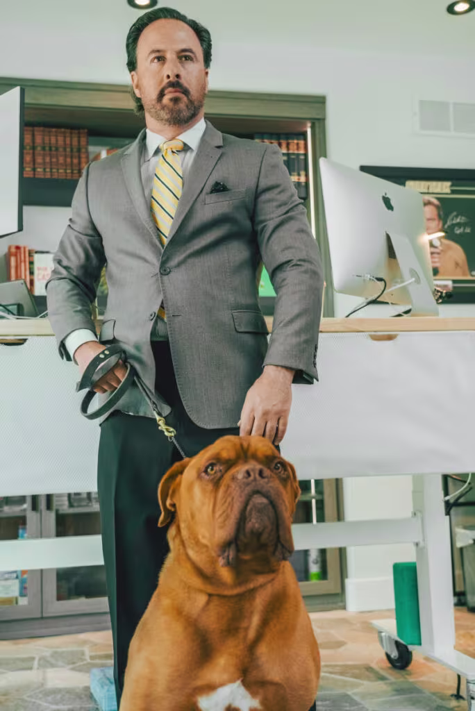 Jeremy Rosenthal Denver personal injury attorney in office with dog